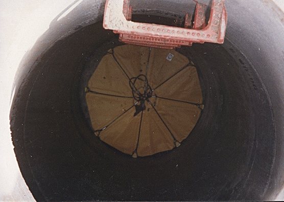 Debris Catcher open at the bottom of a manhole before any work has started